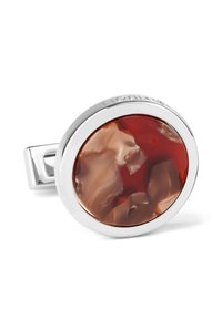 Silver cufflink featuring a circular cabochon with swirls of red and beige, smooth texture, and polished chrome accents.