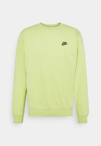 Ljusgrön långärmad Nike-tröja med ribbad mudd och nederkant, med en liten svart Nike-logotyp på vänster bröst.