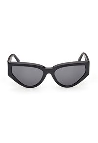 Lunettes de soleil noires style œil de chat avec montures épaisses et verres teintés foncés, présentées sur un fond blanc.