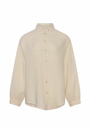 Cream-colored long-sleeve button-up shirt with textured fabric, classic collar, and buttoned cuffs, displayed on a white background.