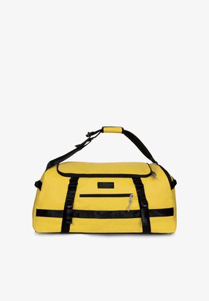 Bolsa de lona amarilla con correas negras, un bolsillo frontal con cremallera y una correa de hombro ajustable con agarre acolchado.
