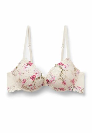 Sujeción color crema con encaje floral rosa superpuesto y tirantes ajustables, con bordes festoneados en las copas y los costados.