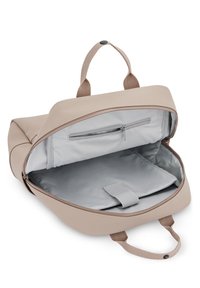 Beige synthetic backpack with a smooth exterior, zippers, and gray fabric lining. Features interior compartments and a small zip pocket.