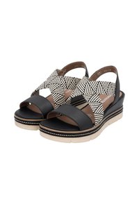 Black leather platform sandals with woven black and white patterned straps, closed back, and textured sole for added grip.