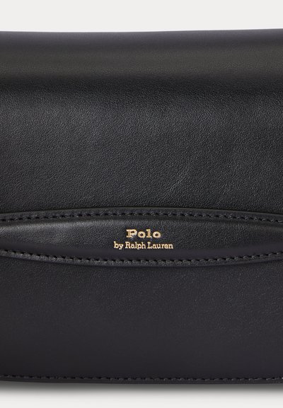 Black leather surface with stitched detail and gold embossed text reading "Polo by Ralph Lauren" in the center.