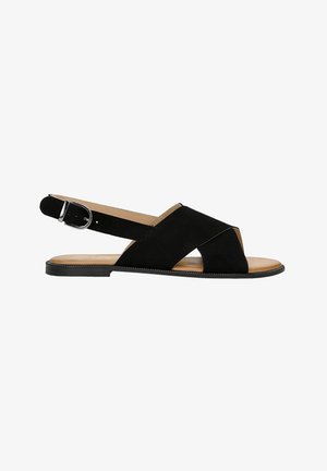 Sandalo in suede nero con design a fascia incrociata, punta aperta e chiusura con fibbia alla caviglia. Suola piatta con soletta in marrone chiaro.