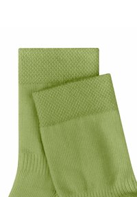 Light green socks featuring a smooth, ribbed texture with a solid pattern. The cuffs have a woven finish and consistent shade throughout.