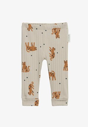 Beige ribstrikkede leggings til småbørn med orange katteillustrationer og sorte pletter spredt over stoffet, med et lille mærke på siden.