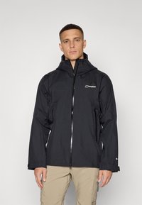 Black waterproof jacket with a hood, zip closure, and front pockets. Features a logo on the chest and long sleeves with adjustable cuffs.