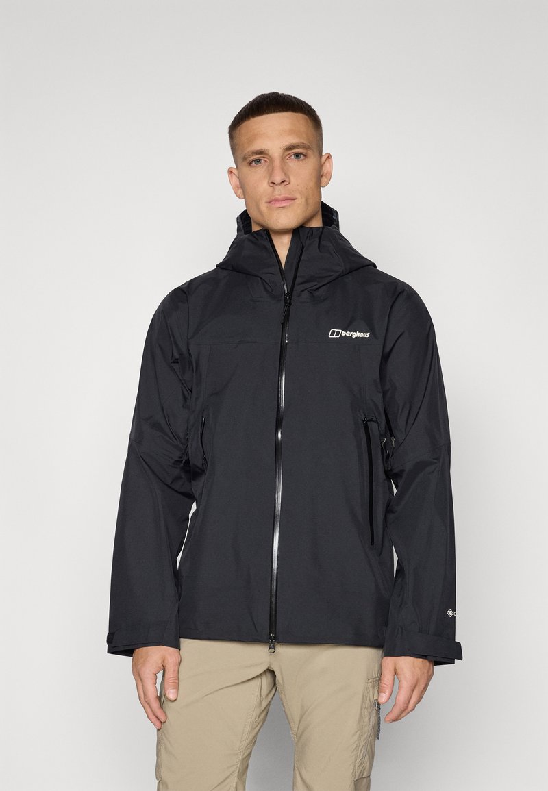 Black waterproof jacket with a hood, zip closure, and front pockets. Features a logo on the chest and long sleeves with adjustable cuffs.