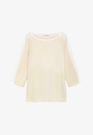 Kremfarvet langærmet skjorte med hvide striber langs ærmerne og en bred rund halsudskæring.