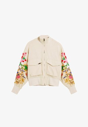 Jachetă bomber bej cu guler înalt, două buzunare frontale și broderie florală vibrantă în roșu, roz, verde, albastru și auriu pe mâneci.