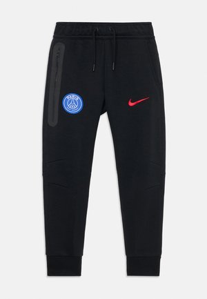 Jogging noirs sportifs avec le logo du Paris Saint-Germain sur la cuisse gauche et le swoosh rouge de Nike sur la cuisse droite, avec une poche zippée et une taille à cordon.