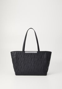 Borsa tote nera realizzata in materiale testurizzato con un motivo geometrico. Presenta manici robusti e una placca con logo metallic.
