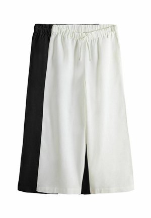 Shorts con cordino bicolore che presentano un lato sinistro nero e un lato destro bianco, realizzati in tessuto leggero con una texture morbida.