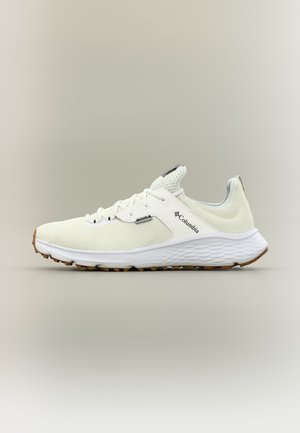 Helebeež Columbia spordijalats võrgumaterjalist pealsega, valge tekstuurse tallaga ja pruuni mustriga, nähtud külgvaates neutraalsel taustal.