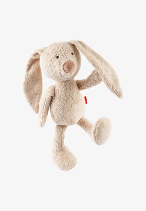 Soft beige plush rabbit toy with long ears, round face, and a small brown nose. Features textured fur and a red tag on one ear.