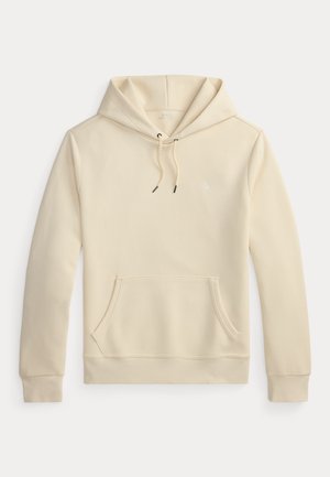 Beežisis värvitoonis kapuutsiga pullover, esiküljel kenguru tasku ja paelaga kapuuts, ees rinnal väike tagasihoidlik tikandiga logo.