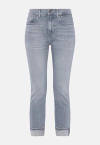 Jeans in denim azzurro chiaro con vestibilità slim, design a cinque tasche, orli risvoltati e una leggera scoloritura su tutta la superficie, dotati di chiusura con bottone e zip.