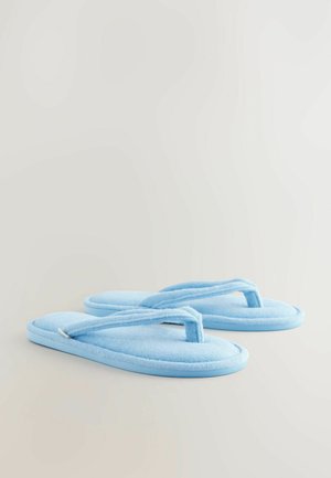Blaue Frottee-Zehentrenner mit einer weichen, strukturierten Sohle und V-förmigen Riemen; abgerundetes Fußbett und dünner Gummirand.