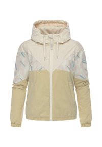 Lichte beige jas met een capuchon, voorzien van een geometrisch patroon in lichtcrème en blauwtinten. Elastische manchet en een rits aan de voorkant.