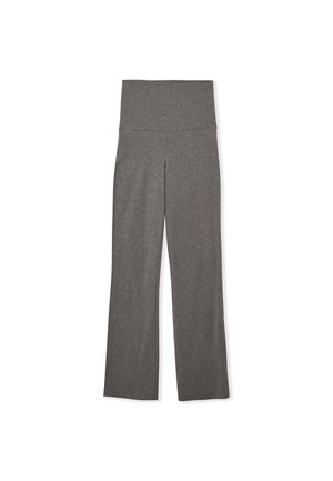 Pantaloni yoga grigi a gamba svasata realizzati in un tessuto morbido e elasticizzato, con vita alta e finitura liscia; senza motivi visibili o decorazioni.