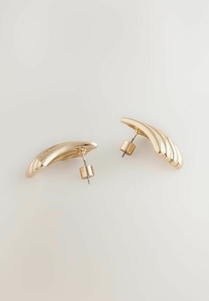 Gold-tone stud earrings with a curved, wave-like design. Smooth texture, featuring a solid structure and secure post backing.