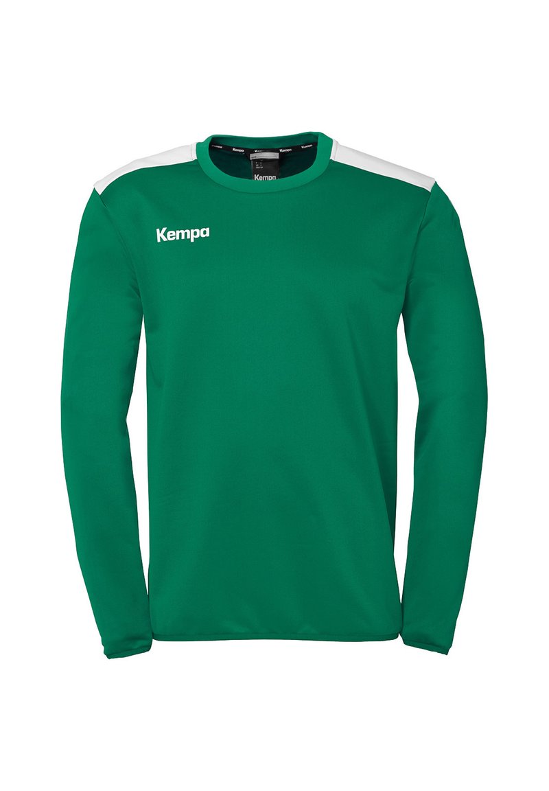 Groene sportieve longsleeve met witte schouderaccenten, met een ronde hals en het "Kempa"-logo op de borst. Glad stoftextuur.