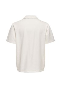 Chemise texturée écrue à manches courtes avec col pointu, vue de dos sur fond blanc.