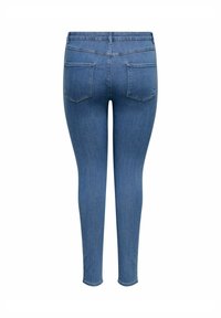 Blugi skinny albaștri din denim. Au două buzunare la spate cu cusături subtile și o talie clasică. Textură netedă peste tot.