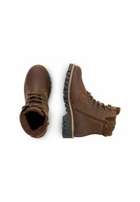 Brune læderstøvler med en tekstureret suede-krave, snørebånd foran og lynlås i siden. Tykkes sorte gummisåler med et mønstret greb.