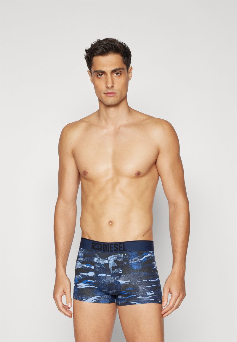 Boxers en diesel pour hommes en bleu marine avec un motif abstrait bleu. Dotés d'un tissu doux et d'une taille élastique avec un détail de logo.
