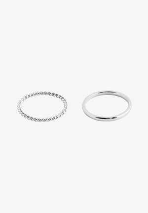 Two silver rings on a white background, one with a twisted rope design and the other with a smooth polished surface.
