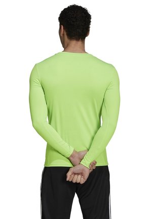 Langärmliges Sportshirt in leuchtendem Neon-Grün, aus einem glatten, dehnbaren Stoff. Mit Rundhalsausschnitt und eng anliegenden Ärmeln.