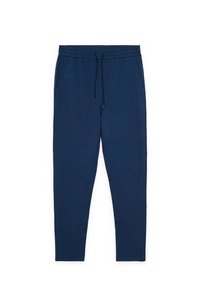 Pantalones de chándal azul marino ajustados con cintura elástica y cordón ajustable, con bolsillos laterales y piernas hasta el tobillo.