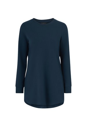 Marineblå langærmet skjorte lavet af blødt bomuldsstof, med rund halsudskæring og rundt nedre kant med slidser i siderne for bedre bevægelsesfrihed.