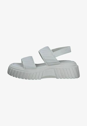 White platform sandals with two quilted straps and an adjustable back strap. Thick, ribbed sole for added grip and cushioning.