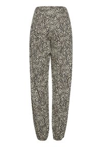 Losse pasvorm broek met zwart en beige gemengd dierenprint, elastische tailleband en cuffs, weergegeven tegen een witte achtergrond.
