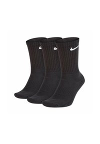 Calzini neri di cotone con texture a coste, con il logo Nike bianco su ciascun calzino. Il pacco contiene tre paia.
