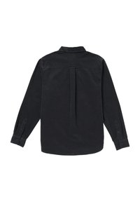 Chemise en velours côtelé noire, à manches longues, dotée d'une fente au dos, de poignets à bouton et d'un col classique. Texture lisse et coupe ajustée.