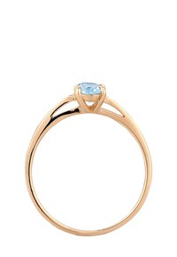 Goldfarbener Ring mit einem hellblauen ovalen Stein, ausgestattet mit einem glatten Band und einem einzigartigen geteilten Schaft-Design. Polierte Oberfläche ohne zusätzliche Verzierungen.