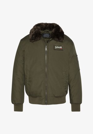 Giubbotto bomber verde oliva con colletto in pelliccia sintetica, polsini e orlo a costine, e chiusura frontale con zip e tasca laterale. Patch con logo Schott.