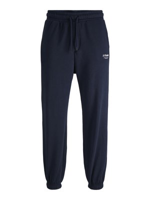 Pantaloni de jogging navy din amestec de bumbac, cu talie elastică și șnur, manșete la gleznă și un mic logo imprimat pe coapsa stângă.