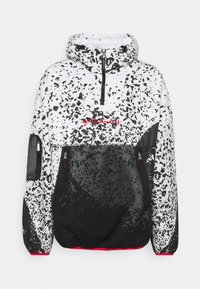 White and black speckled hooded jacket with front zipper, two zippered pockets, and red embroidered text centered on chest.