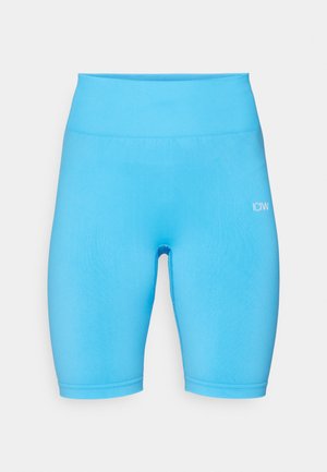 Shorts da ciclismo a vita alta di un blu brillante, realizzati in materiale elasticizzato. Presentano una texture liscia e un piccolo logo bianco sul davanti.