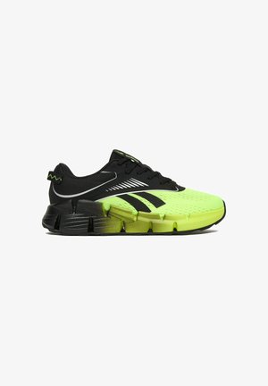 Running shoe with black upper and neon green mesh toe, black and green segmented sole, black laces, and brand logo on side and tongue.