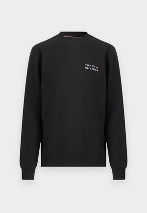 Felpa nera con scollo rotondo, maniche lunghe e piccolo logo bianco Tommy Hilfiger sul petto a sinistra.