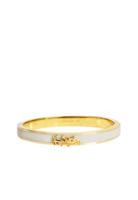 Gold bangle with white enamel inlay, featuring a raised horse and carriage design. Smooth finish, oval shape, elegant and lightweight.