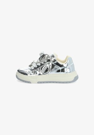 Metallic silver sneaker with round toe, rubber sole, decorative accents, and contrasting cream-colored collar. Features intricate detailing on upper.