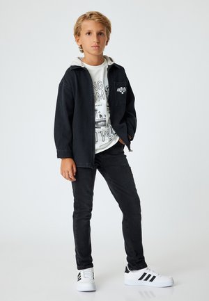 Vaqueros slim fit - black
